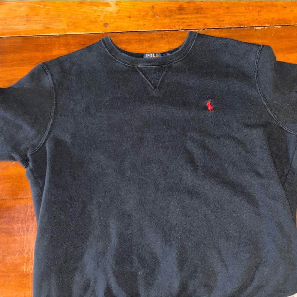 Polo sweater, black with red logo.